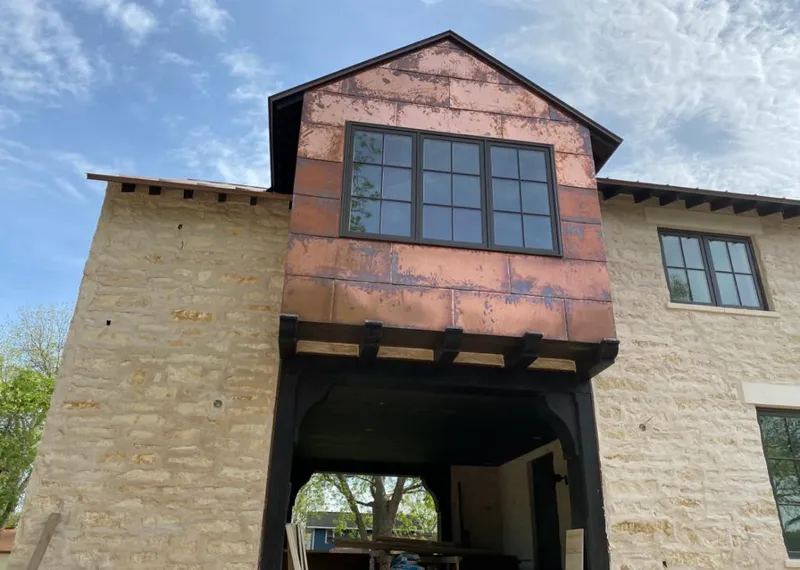 Copper metal panel facade on a stone building for Metal Roof Coating in Bardmoor