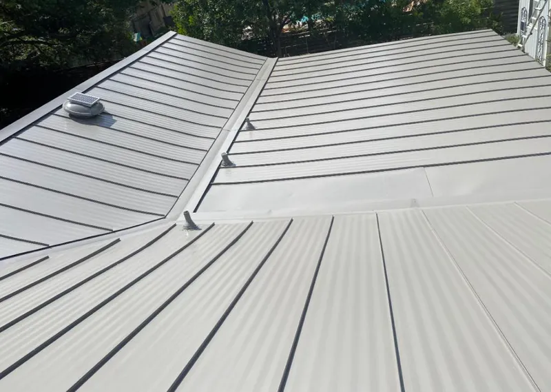 Solar attic fan installed on a metal roof for Roof Ventilation in Bardmoor